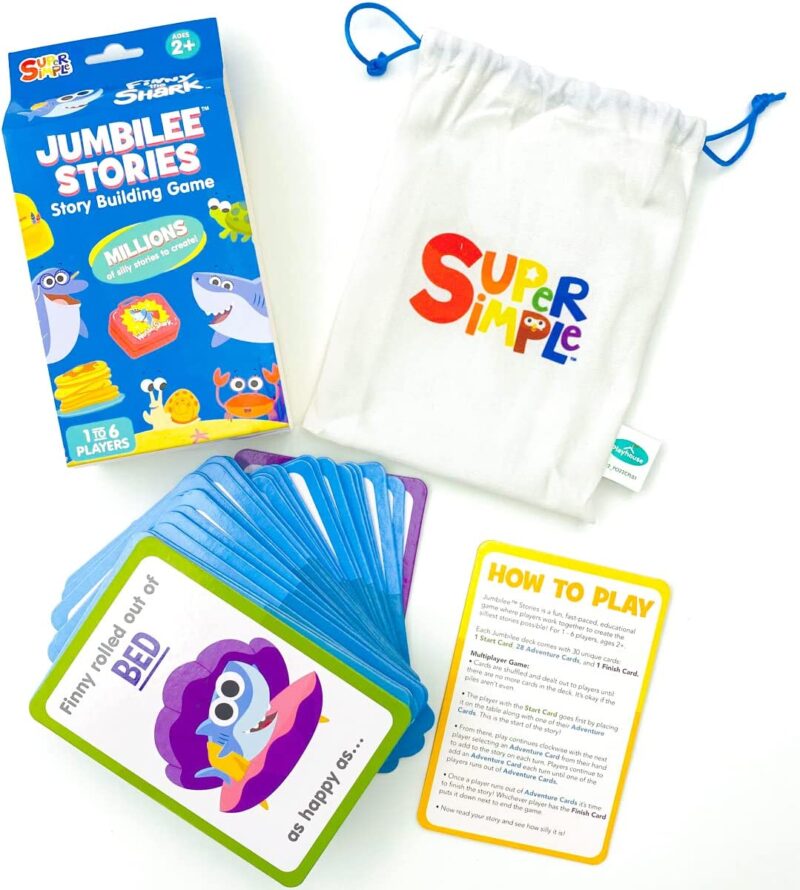 A white bag says Super Simple in rainbow letters. Cards are spread out and show the beginning of a story on them (fun card games)