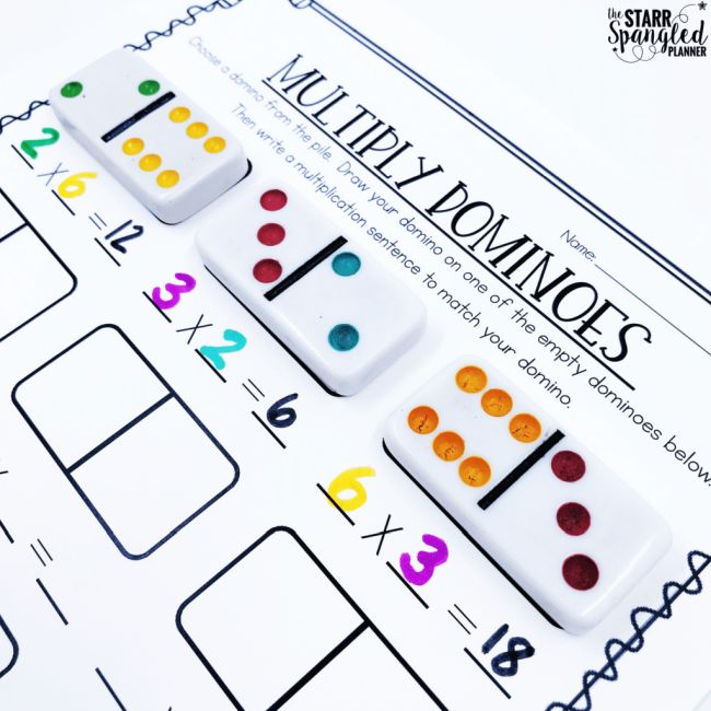 Dominoes laid out on a worksheet to teach multiplication