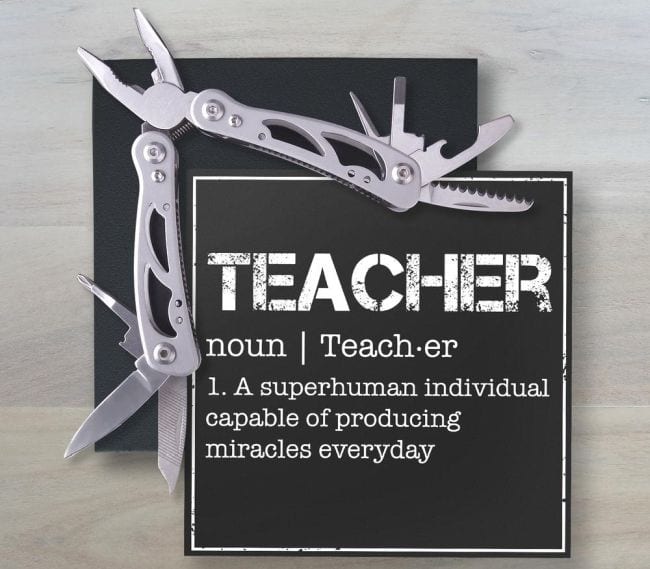 Multi Tool with a card defining teacher as a superhuman individual capable of producing miracles every day