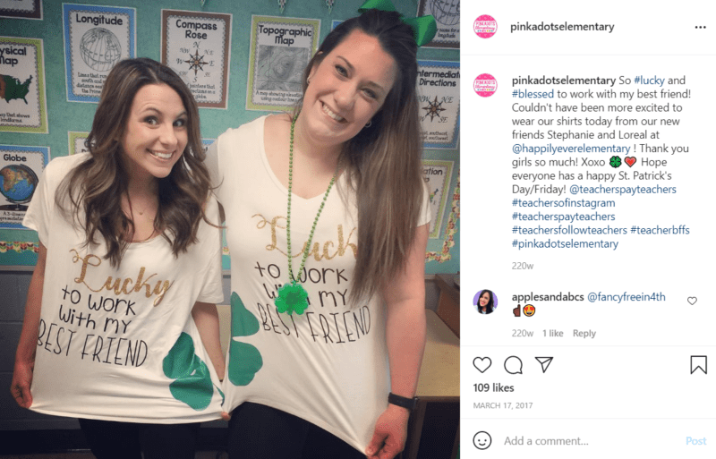 Two teachers pose in a classroom while wearing matching Lucky shirts