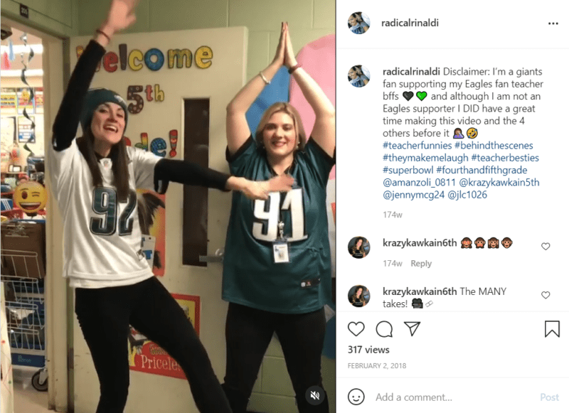 Two teachers posing in Philadelphia Eagles jerseys in classroom