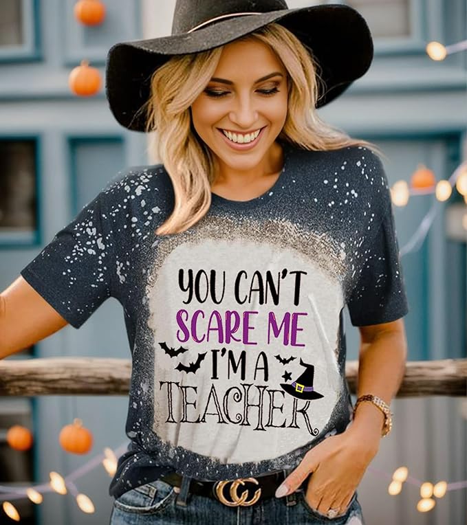 Teacher wearing a t-shirt that says "You can't scare me I'm a teacher"
