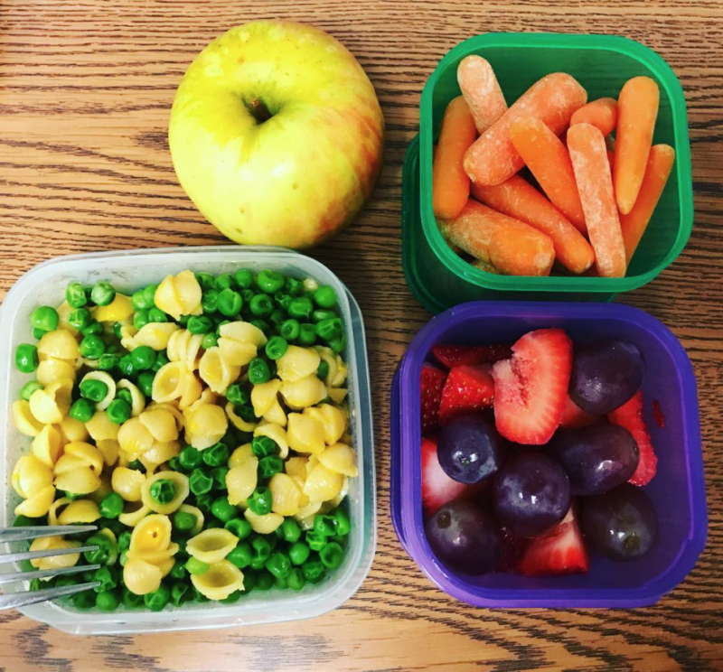 Mac and cheese plus peas, baby carrots, and fruit in small individual containers