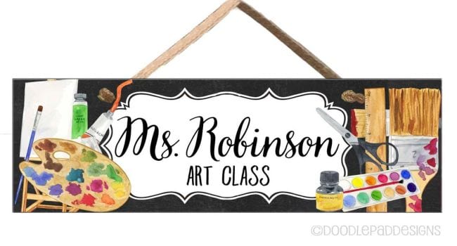 Teacher name sign with art supplies like paint palette and paintbrushes (Teacher Name Signs)