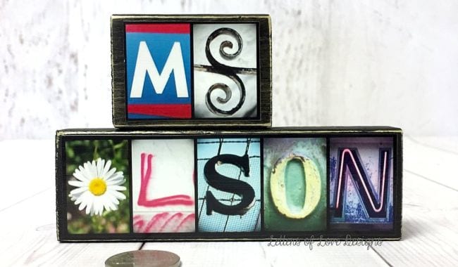 Letters in a variety of styles mounted on black wood blocks to spell Ms Olson (Teacher Name Signs)