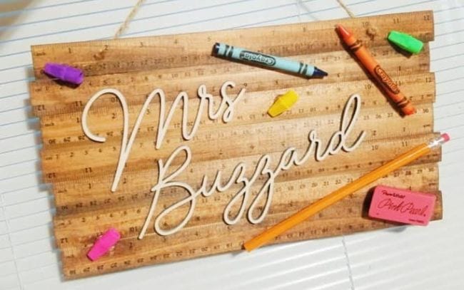 Sign made of wooden rulers with crayon decorations and the name Mrs. Buzzard (Teacher Name Signs)