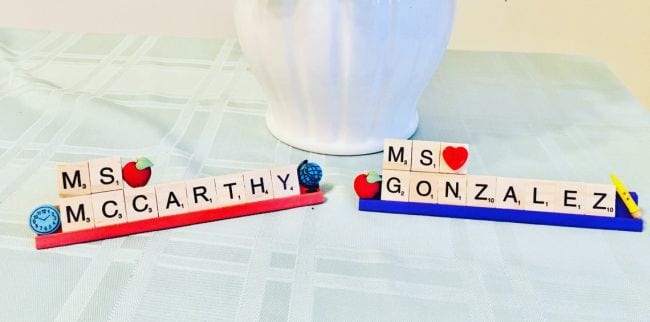 Name signs made from Scrabble letter tiles and wooden accents