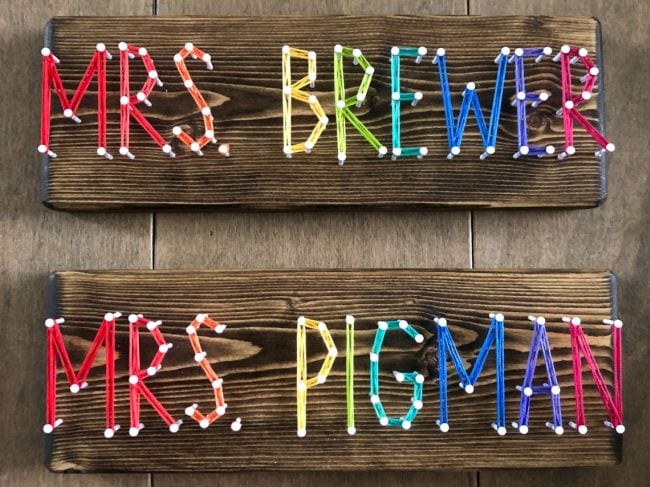 Teacher names spelled out in colorful string strung between nails (Teacher Name Signs)