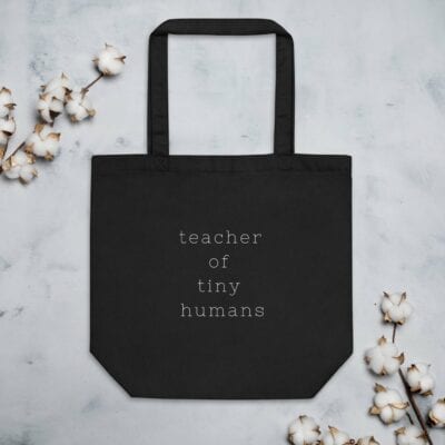 Teacher of tiny humans tote bag in black