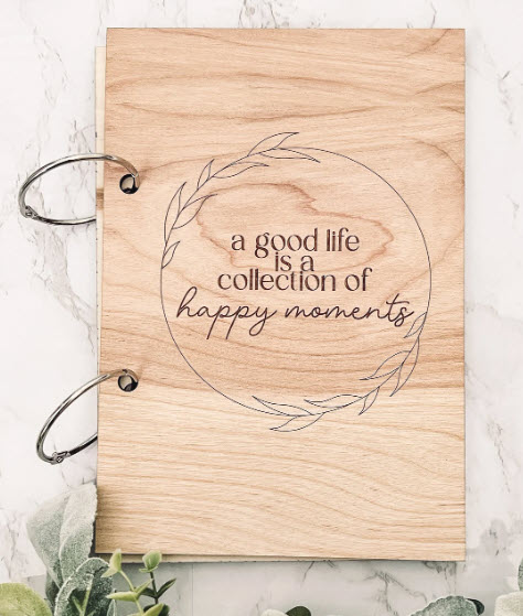 Engraved wood card keeper with text reading A Good Life is a Collection of Happy Memories