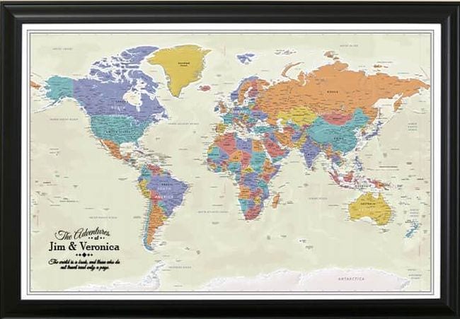 Framed map of the world with push pins inserted in various locations