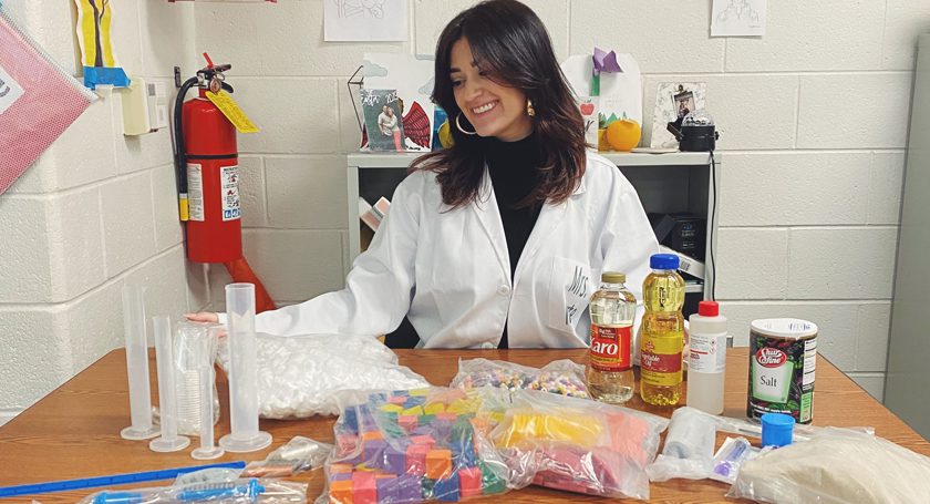 Teacher using science kit