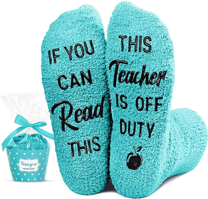 Light blue socks with soles saying "If You Can Read This, This Teacher is Off Duty"