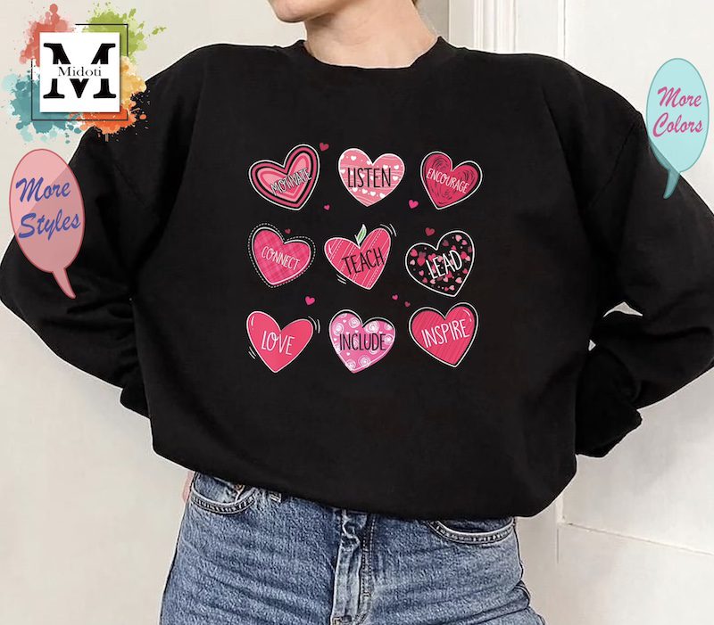 Black long sleeved shirt with pink hearts and motivating words