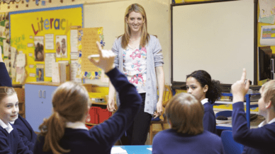 Teacher call students by name, hands wave in classroom.