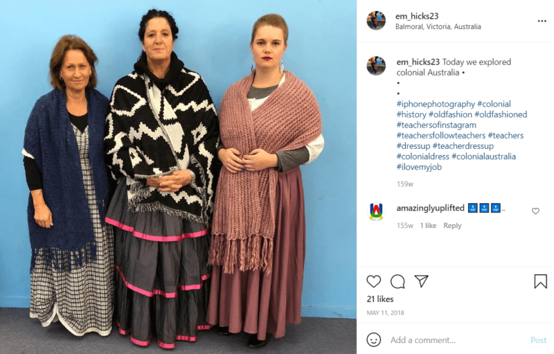 Three teachers in front of a blue wall dressed as colonial Australians