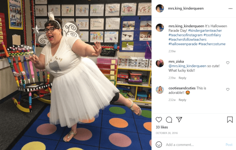 Teacher in a classroom with polka dot carpet dressed as the tooth fairy