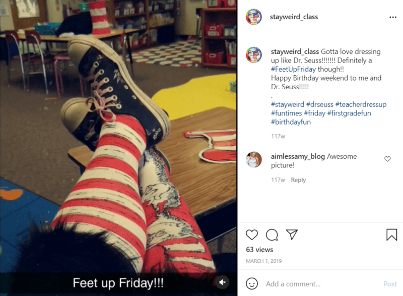 Teacher wearing red and white striped socks, one featuring the cat in the hat to celebrate the birthday of Dr. Seuss