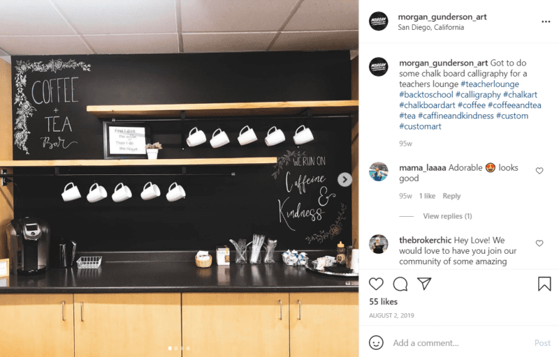 Chalkboard wall along a coffee counter with coffee maker and mugs