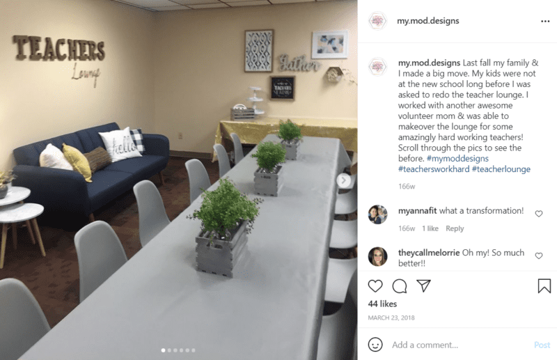 Long grey table with seating around it and a blue couch with a Teachers Lounge sign above it