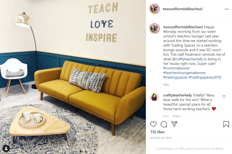 Teachers lounge with a mustard yellow couch and blue wall paint and a sign that says "Teach Love Inspire"