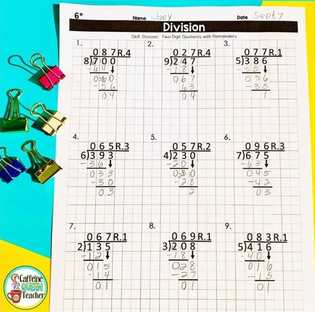 Long division problems laid out on graph paper