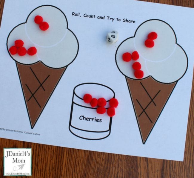 Printed worksheet with two ice cream cones and pile of red poms poms representing cherries