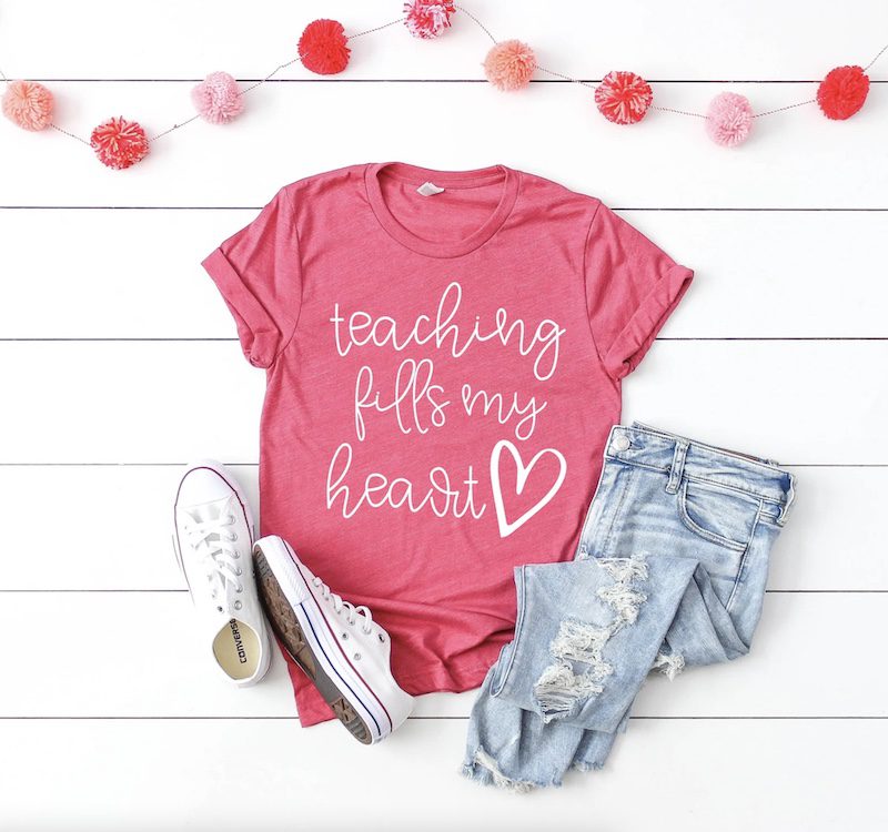Pink shirt that says Teaching Fills My Heart