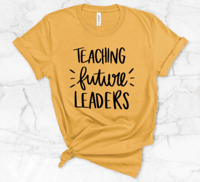 Yellow teacher shirt saying "teaching future leaders," as an example of Etsy teacher shirts