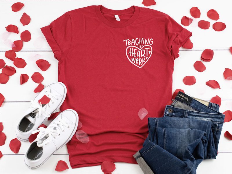 Red shirt with the words Teaching Is Heart Work