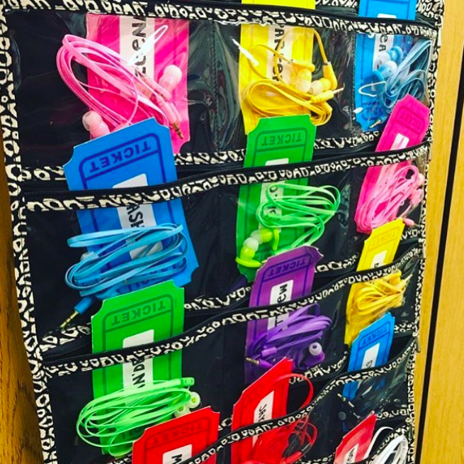 A plastic shoe holder hold color-coded earphones for students