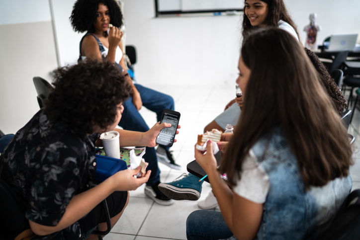 teens enjoying a snack in the classroom- mental health activities for teens
