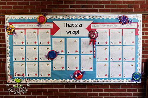 A bulletin board says that's a wrap. It has large fake candies on it and letters from students.