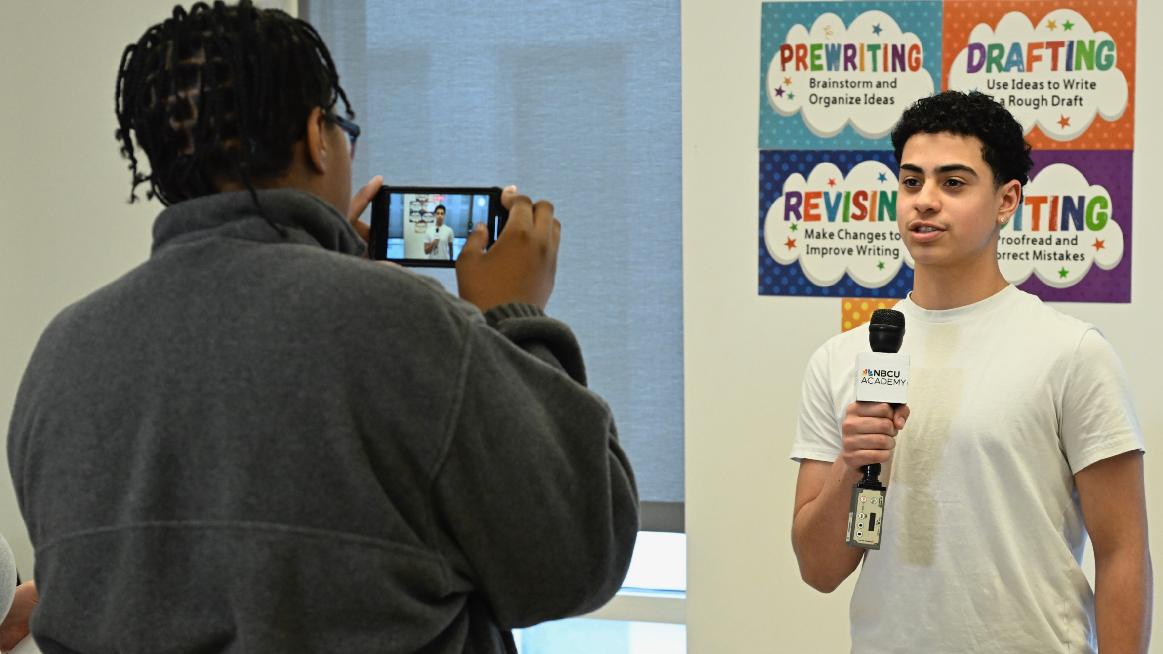 an image of two students producing their own broadcast