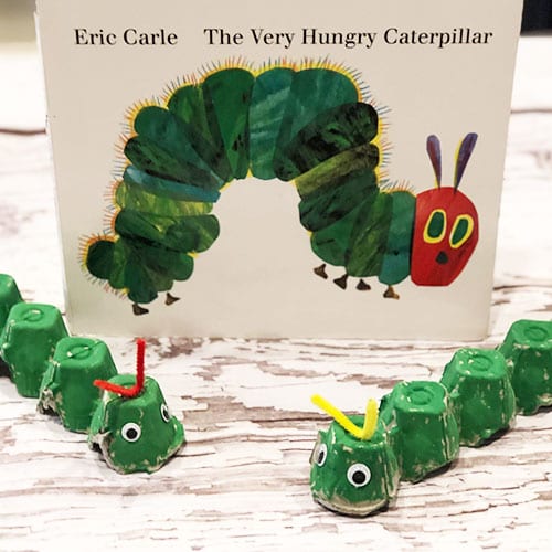 Egg carton caterpillars in front of The Very Hungry Caterpillar book