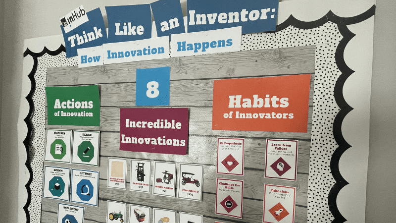 "Think Like an Inventor" bulletin board on a wall