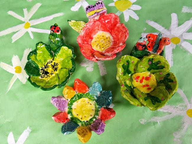 Simple ceramic flower bowls with bugs and butterflies (Third Grade Art Projects)