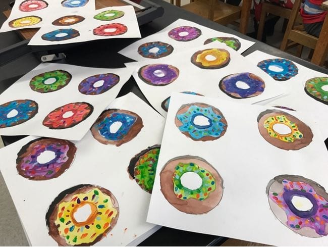 Watercolor painted donuts in a variety of colors