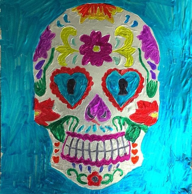 Third grade art projects include this colorful Mexican sugar skull imprinted on aluminum foil 