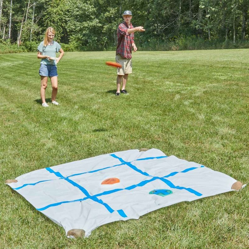 People playing tic tac toe with frisbees- summer activities for kids