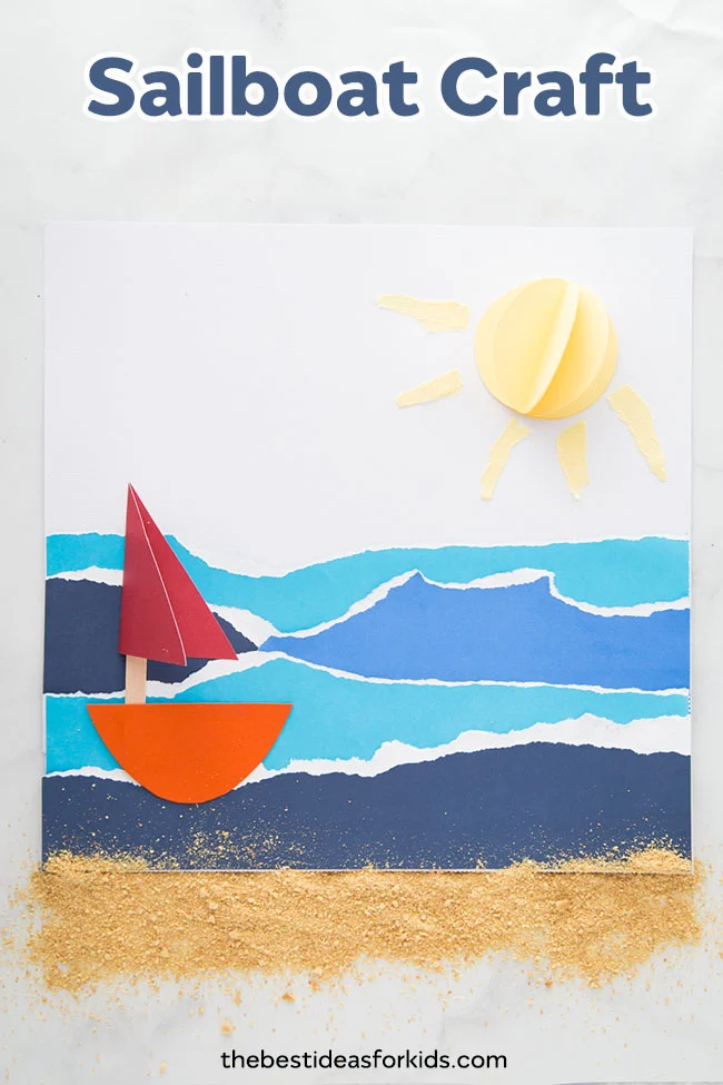 A red sailboat floats on a brilliant blue sea in this seascape made from torn paper