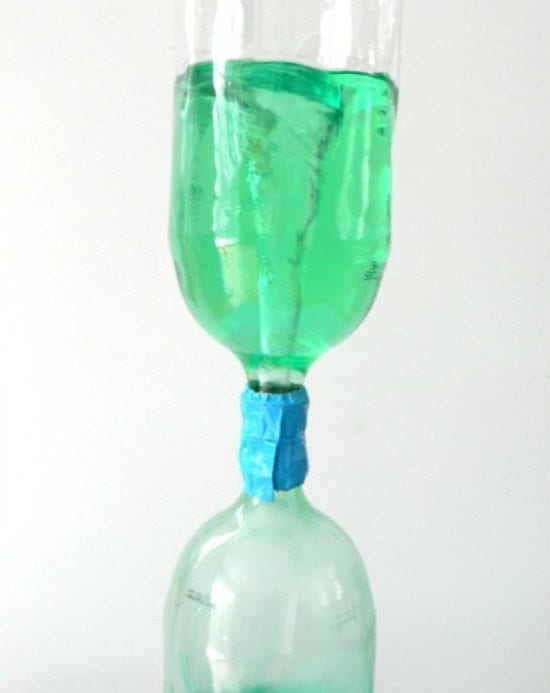 two liter soda bottles duct taped together at the mouths. green liquid from top bottle is swirling down into bottom bottle- weather activities
