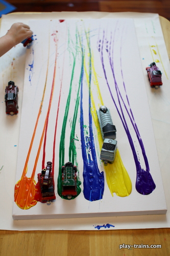 Collaborative art can even include toys like this one that uses toy trains dragged across piles of paint on a canvas to create a painting.