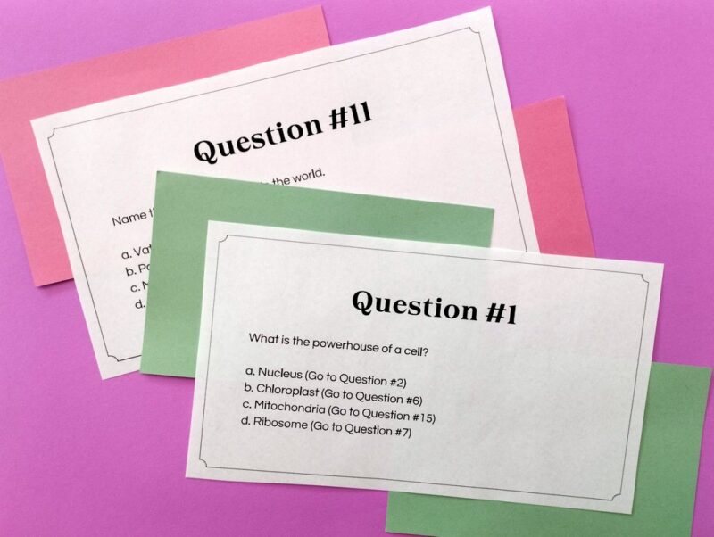 Trivia trail questions on individual cards against a pink background