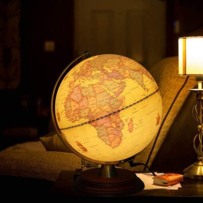 TTKTK Illuminated Antique Globe shown lit up on a living room side table