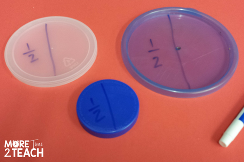 three plastic lids divided into halves for teaching fractions 