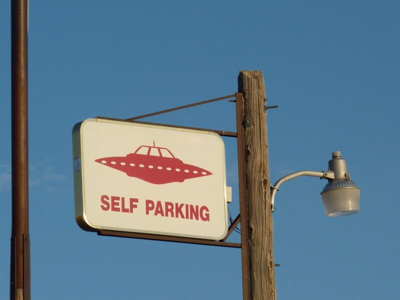 Sign saying UFO Parking with picture of a flying saucer