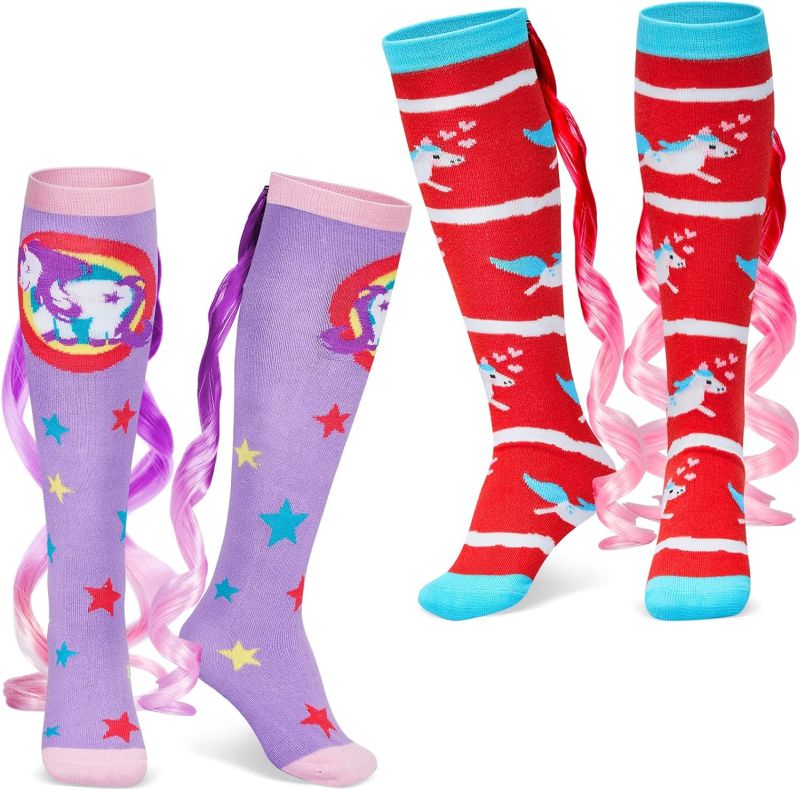 Colorful knee-high socks with unicorn theme and long curly tails on the back