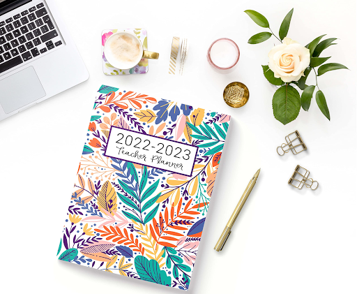 Teacher planner with tropical colored leaves design and 2023-2024 dates on the cover