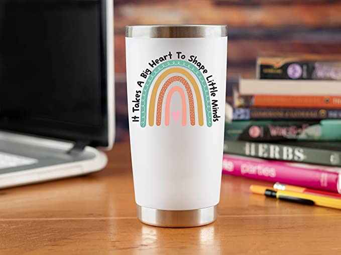 Tumbler on teacher desk that says It Takes a Big Heart to Shape Little Minds, as an example of teacher valentine gifts